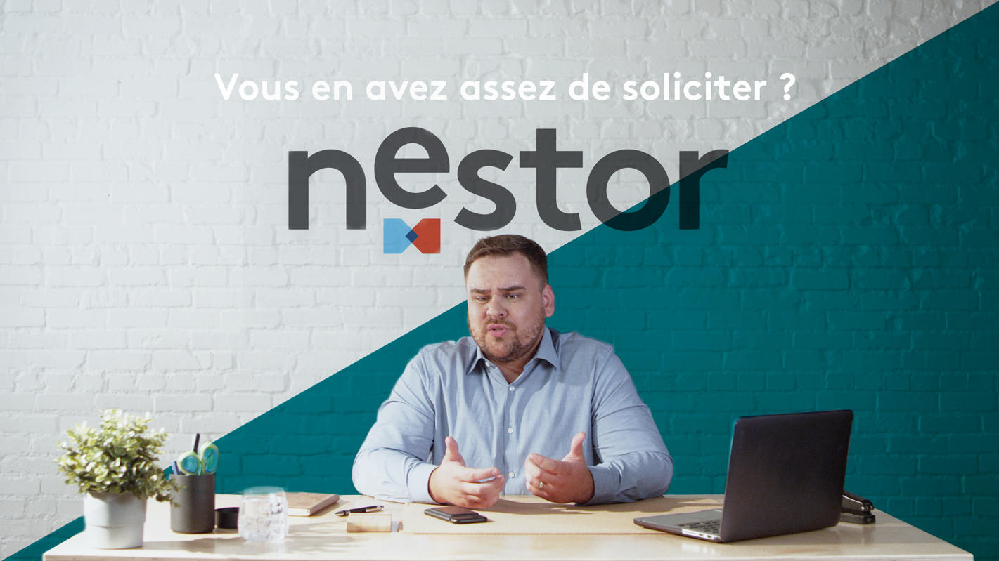 man working sitting at desk ads, Nestor